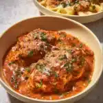 Slow Cooker Creamy Tomato Basil Chicken Breast served with fresh basil garnish.